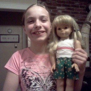 Amy and her doll wearing her sports shorts