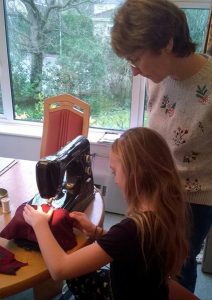 Ruth and granddaughter sewing lessons